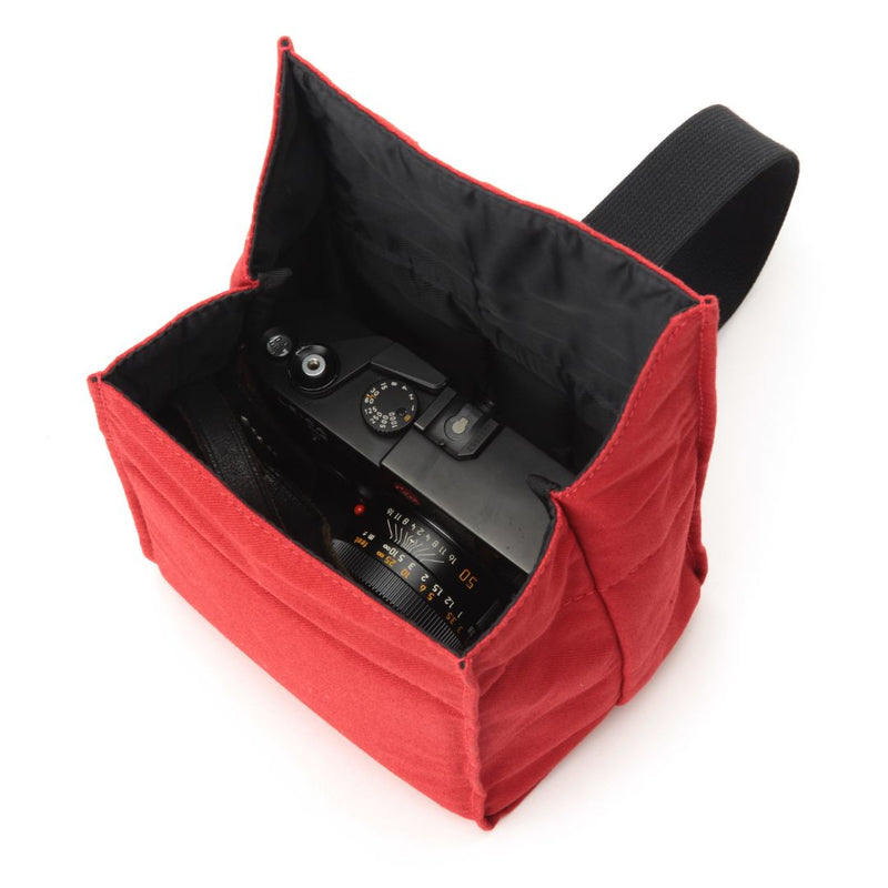 Red ACAM-75 Soft Camera Pouch holding a professional rangefinder camera body, made in Japan.