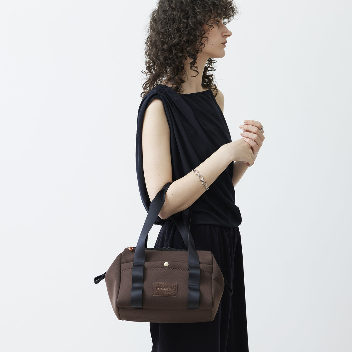 New Duality compressed polyurethene hand bag