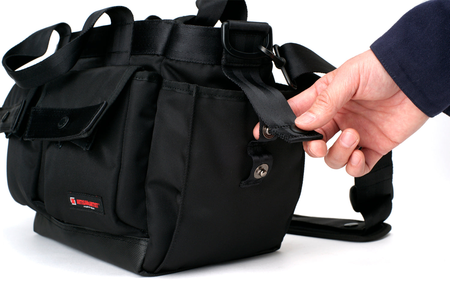 Shoulder-tote-type camera bag with a wide opening.